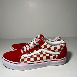 Red low top checkered vans